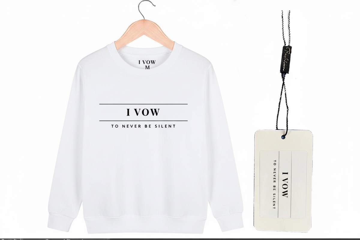 White sweatshirt with 'I VOW' text on a hanger with a tag.